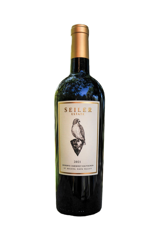 Wine bottle with Seiler Estate label against a blurred natural background