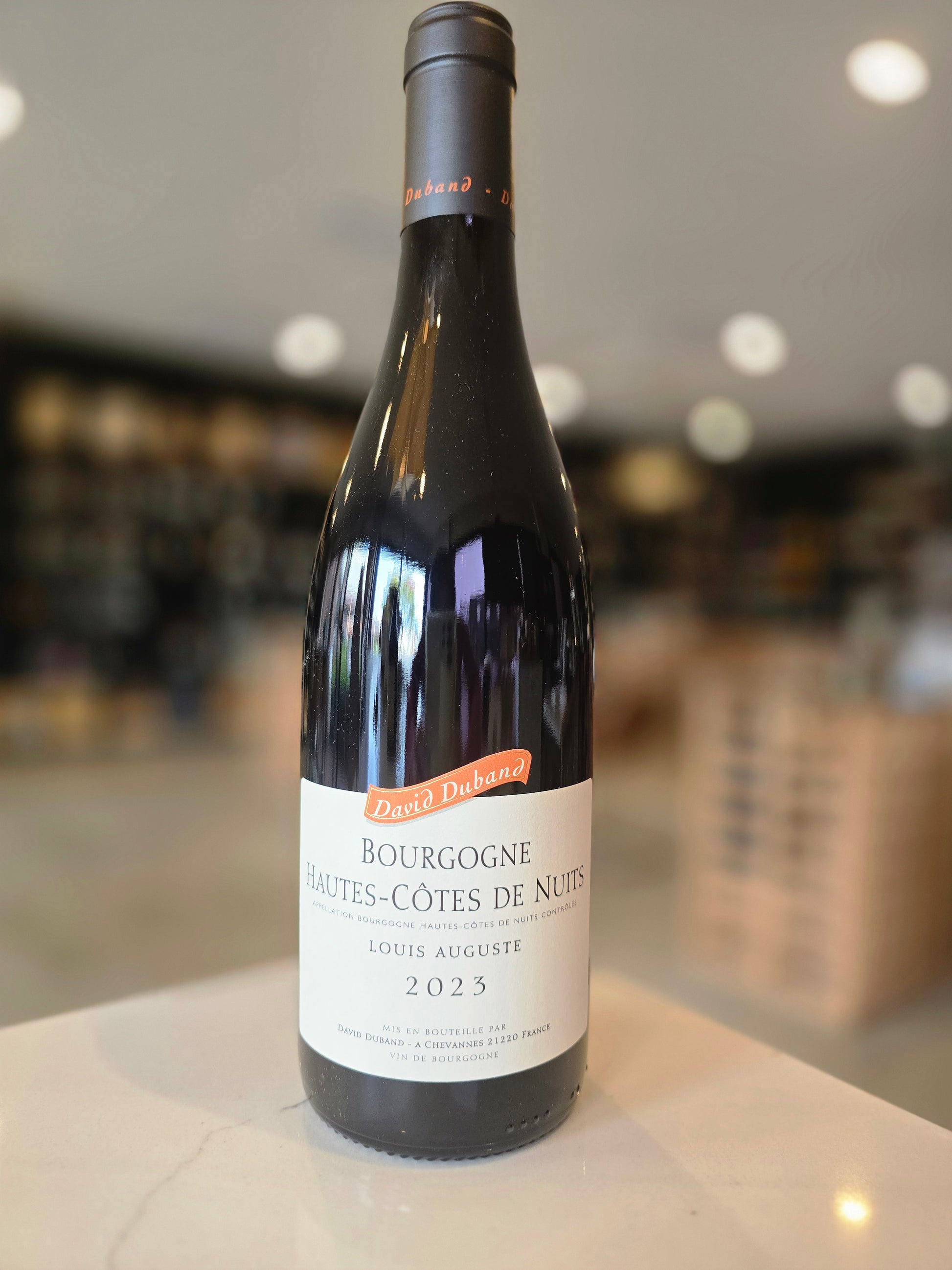 Wine bottle with a label on a blurred background