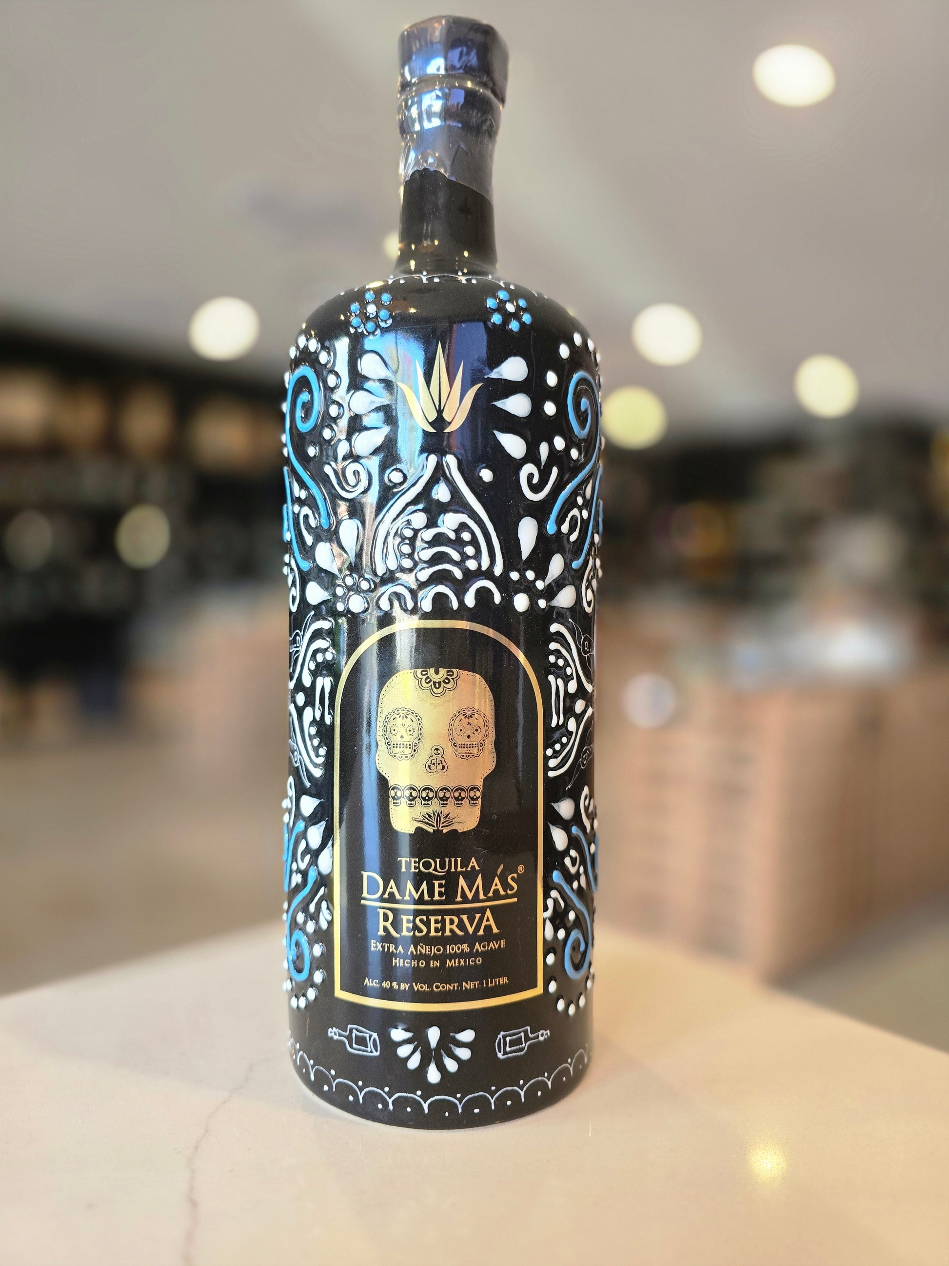Decorative bottle with intricate designs on a blurred background